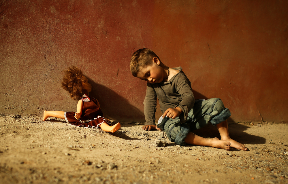 alone sad child on a street